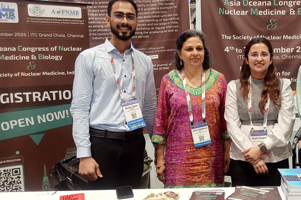 Dr. Mohit Seth with colleagues at the Society of Nuclear Medicine India community booth